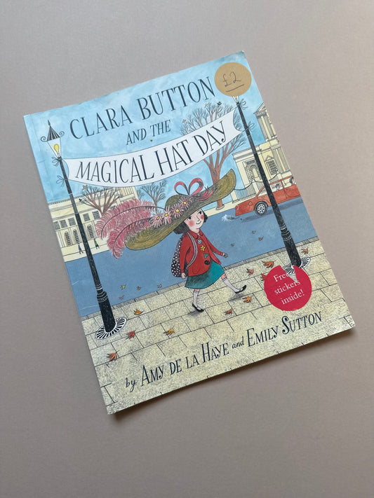 Clara Button & The Magical Hat Day Paperback Book By Amy De La Haye